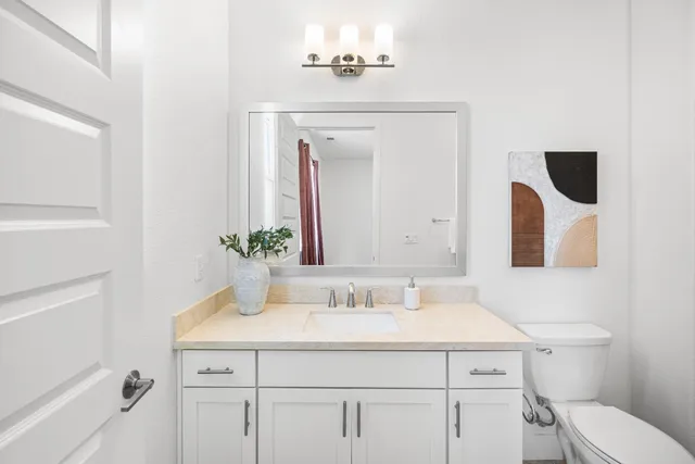 a bathroom with a sink double vanity and a mirror