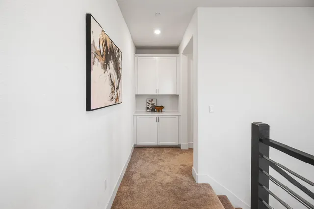 a bathroom with a shower sink vanity mirror and toilet