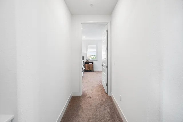 a bathroom with a shower sink vanity mirror and toilet