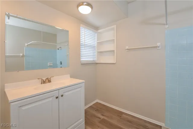 a bathroom with a sink and a mirror