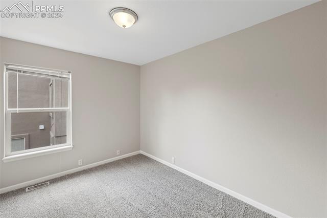 6725 Akron Road Colorado Springs, CO 80923 - Photo 30 of 50 View of carpeted spare room