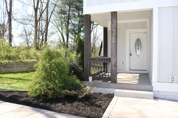 a front view of a house with garden