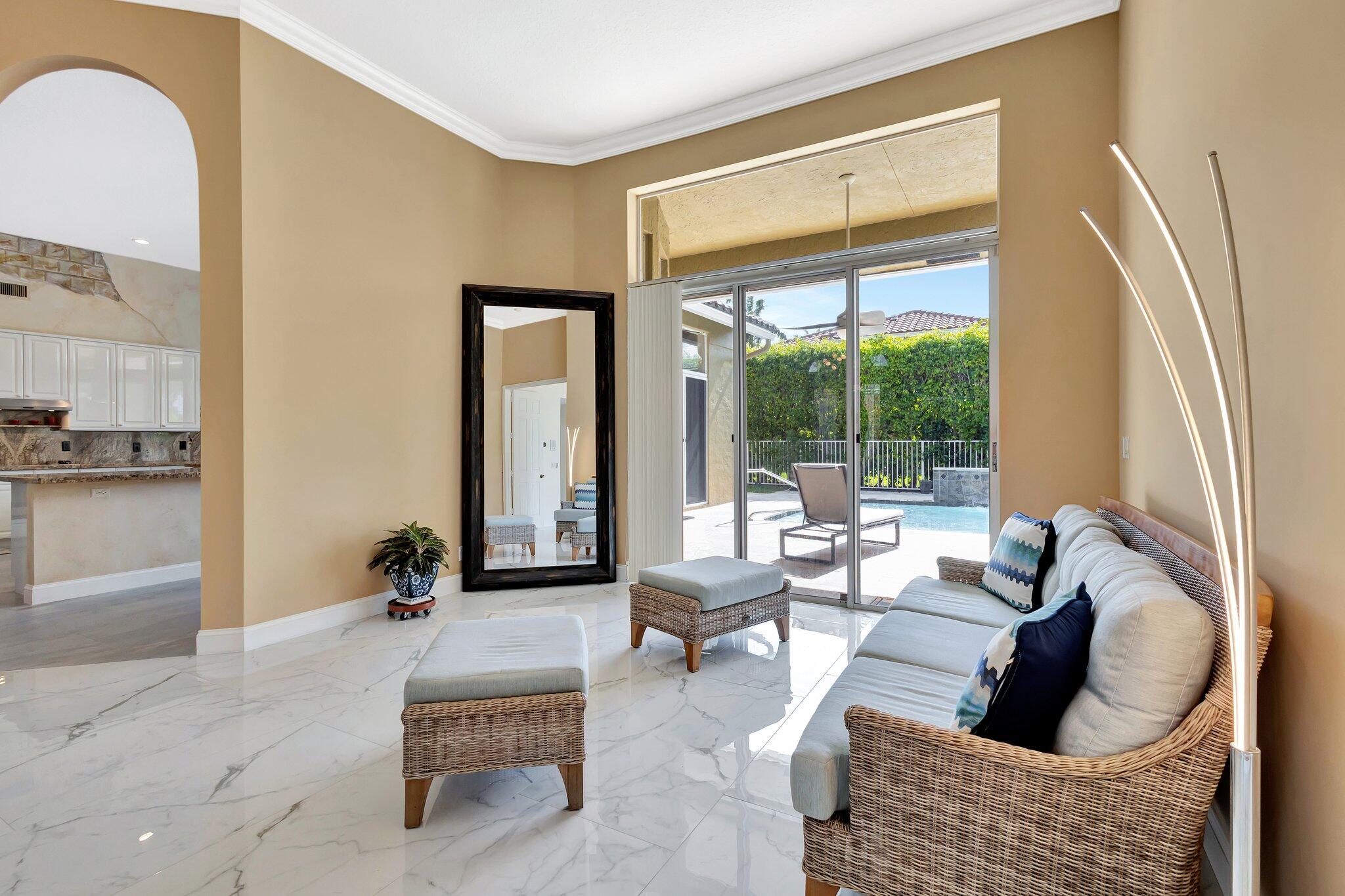 19236 Bay Leaf Court Boca Raton, FL 33498 - Photo 16 of 100 a living room with furniture and a large window