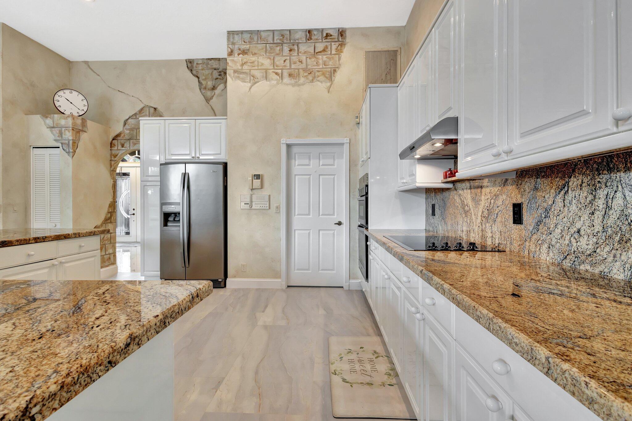 19236 Bay Leaf Court Boca Raton, FL 33498 - Photo 20 of 100 a large kitchen with cabinets