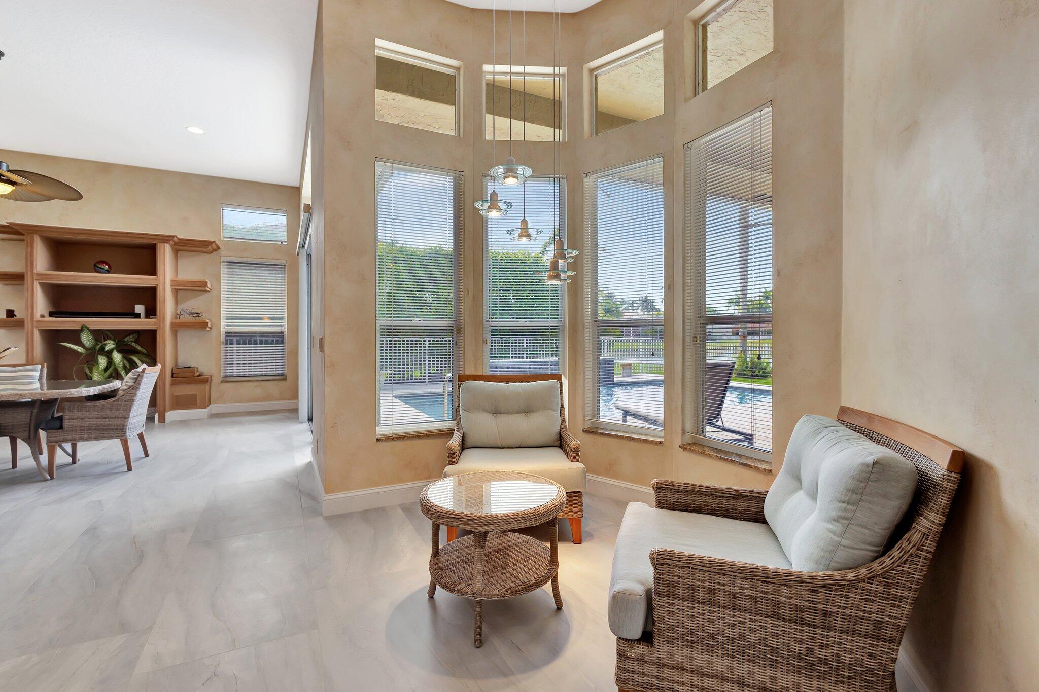 19236 Bay Leaf Court Boca Raton, FL 33498 - Photo 27 of 100 a living room with furniture and a large window