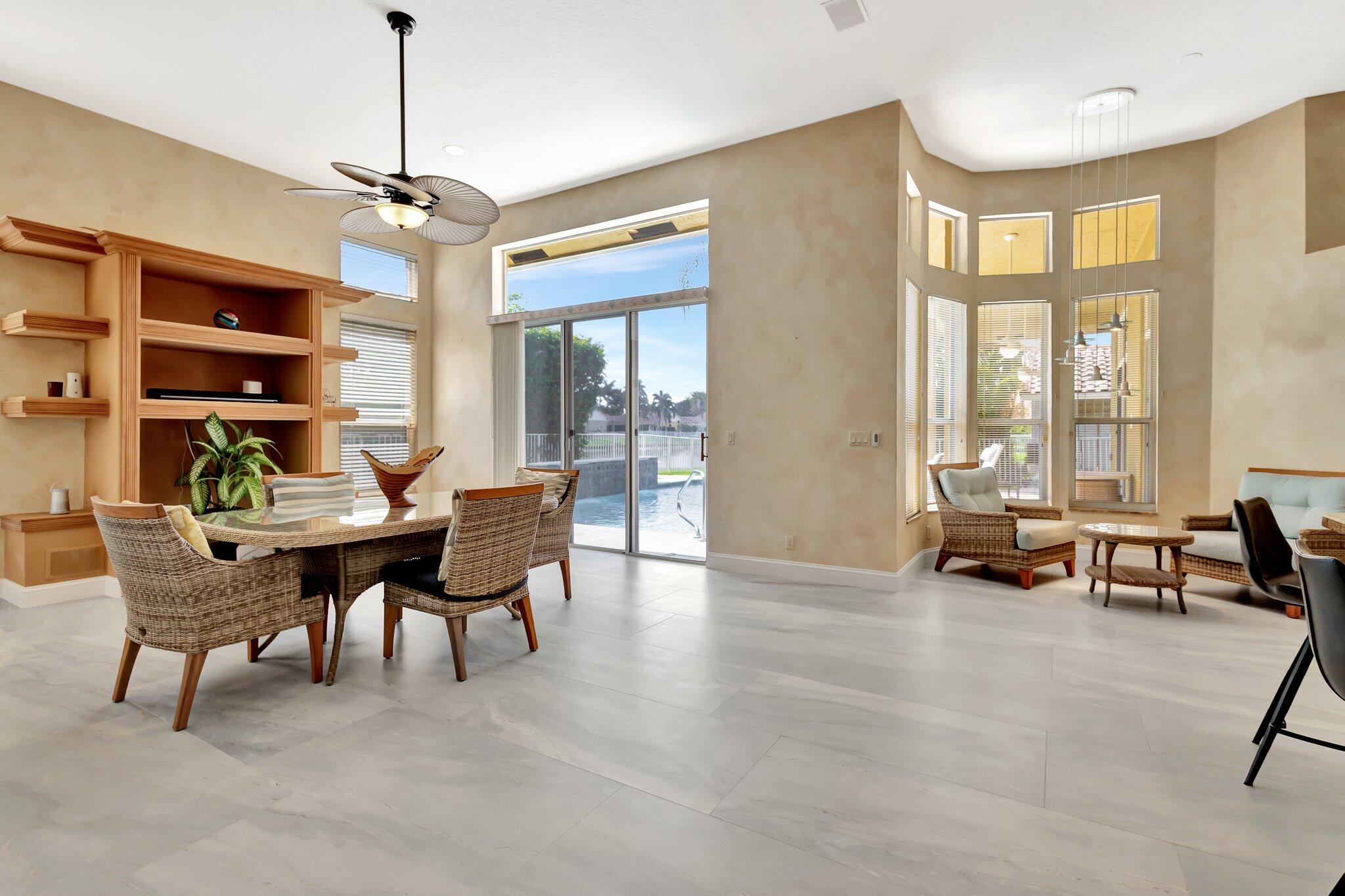 19236 Bay Leaf Court Boca Raton, FL 33498 - Photo 29 of 100 a dining room with furniture a chandelier and a rug