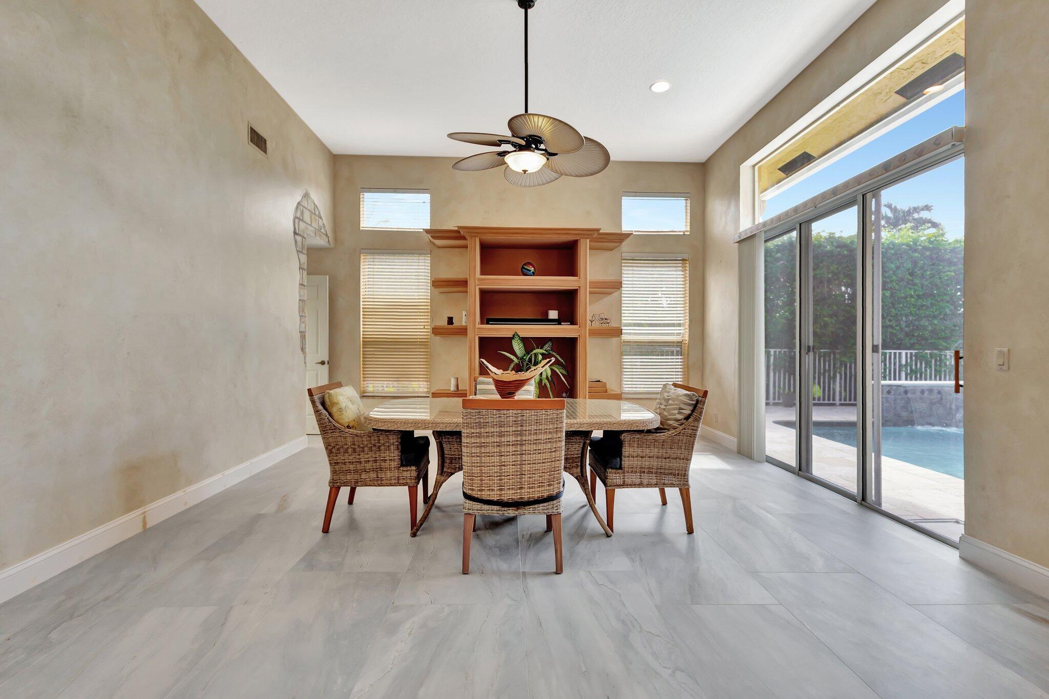 19236 Bay Leaf Court Boca Raton, FL 33498 - Photo 30 of 100 a view of a dining room with furniture window and wooden floor