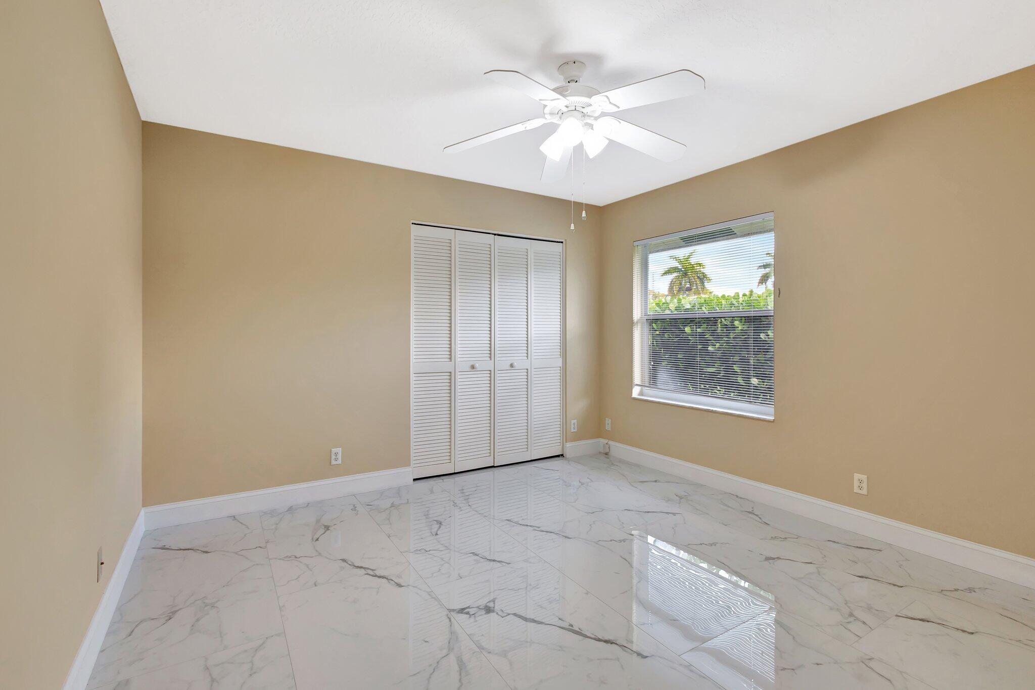 19236 Bay Leaf Court Boca Raton, FL 33498 - Photo 50 of 100 an empty room with windows