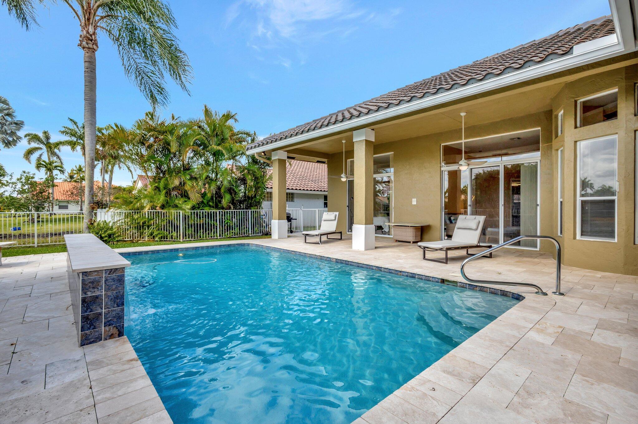 19236 Bay Leaf Court Boca Raton, FL 33498 - Photo 55 of 100 a view of a house with swimming pool and sitting area