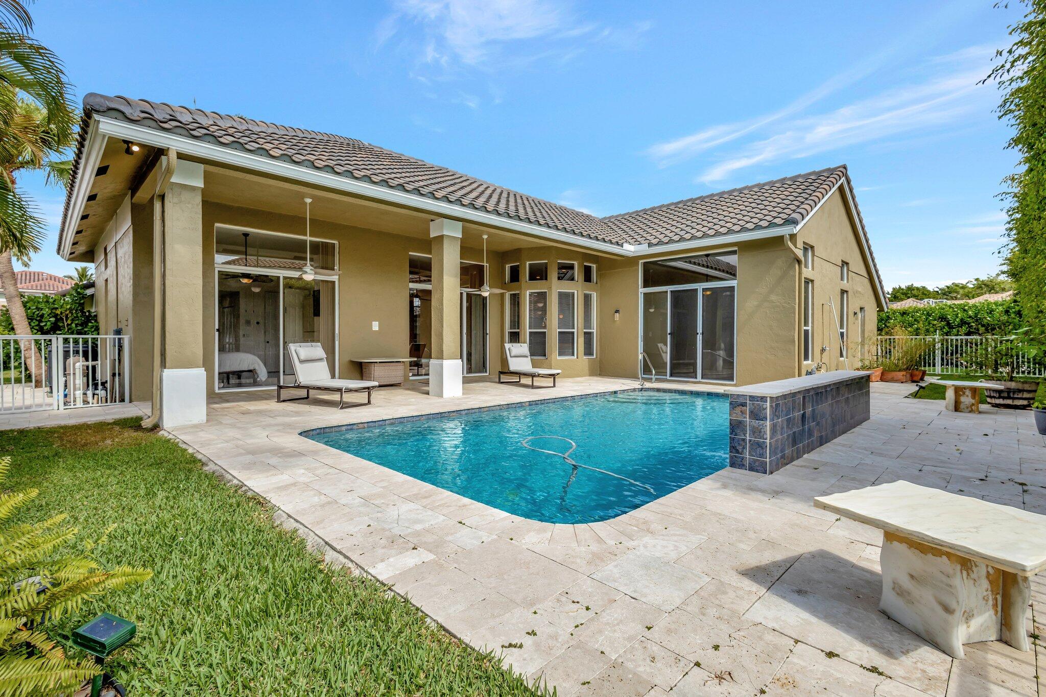 19236 Bay Leaf Court Boca Raton, FL 33498 - Photo 57 of 100 front view of a house with a yard