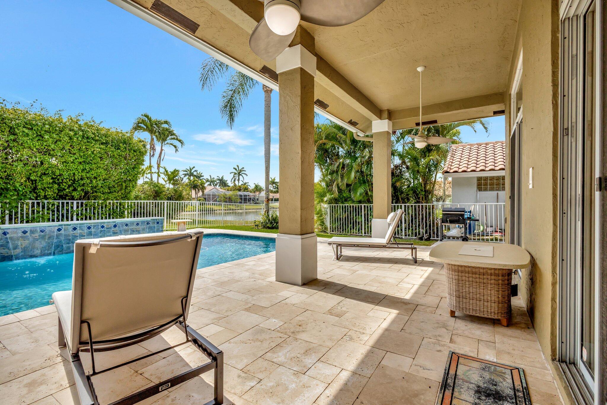 19236 Bay Leaf Court Boca Raton, FL 33498 - Photo 60 of 100 a view of a patio with a table chairs and backyard