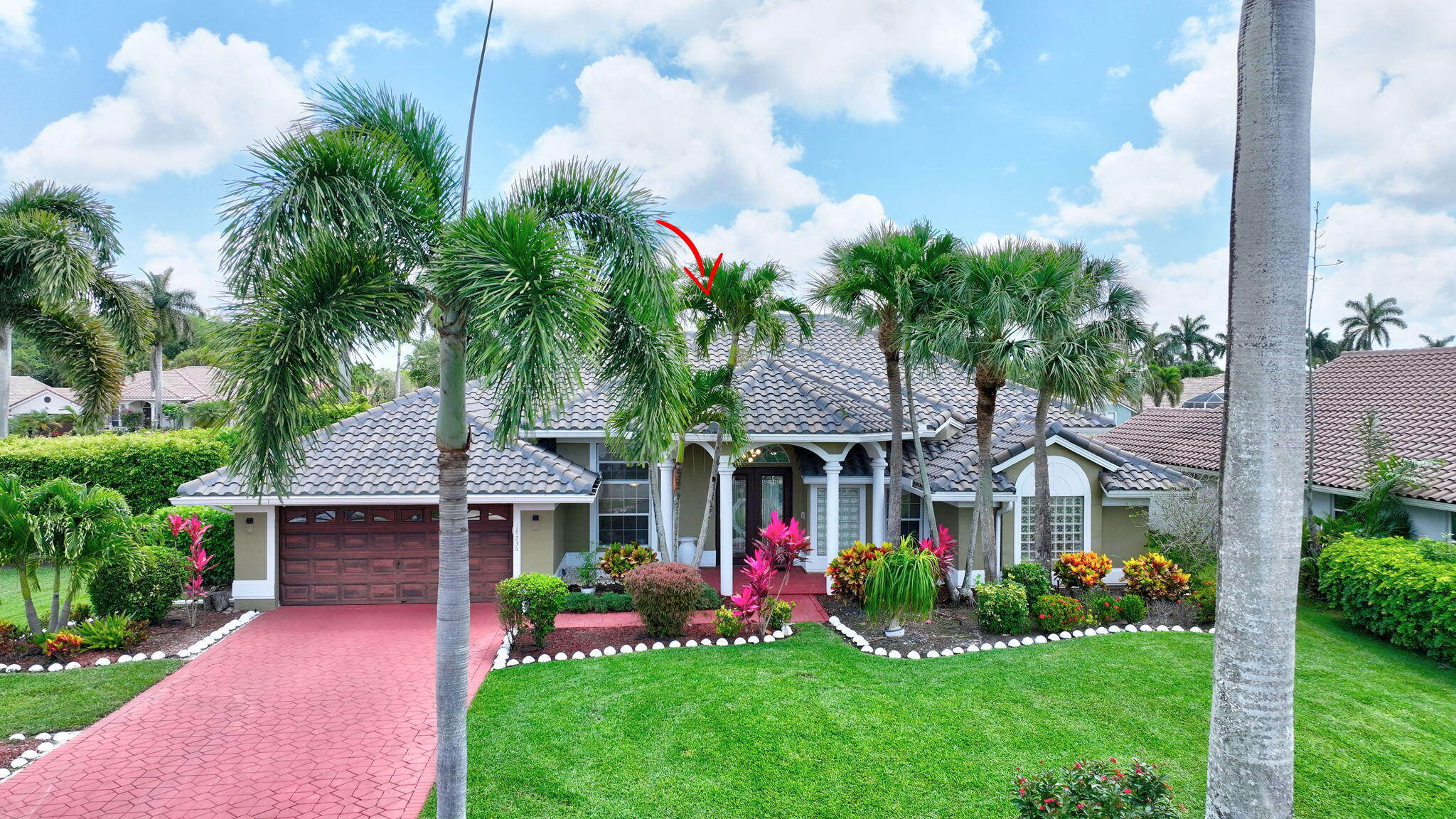 19236 Bay Leaf Court Boca Raton, FL 33498 - Photo 63 of 100 a front view of a house with garden