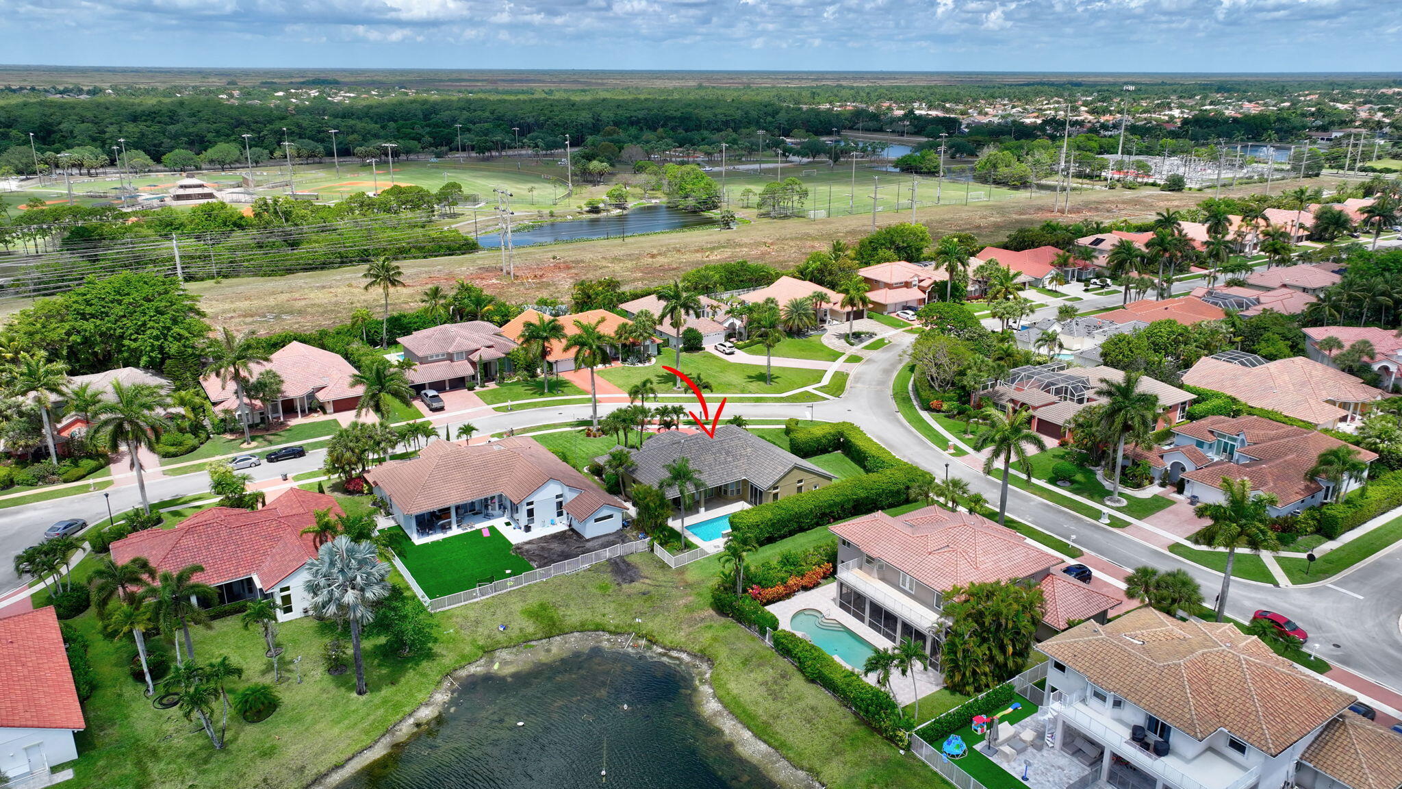 19236 Bay Leaf Court Boca Raton, FL 33498 - Photo 72 of 100 an aerial view of lake residential houses with outdoor space and lake view