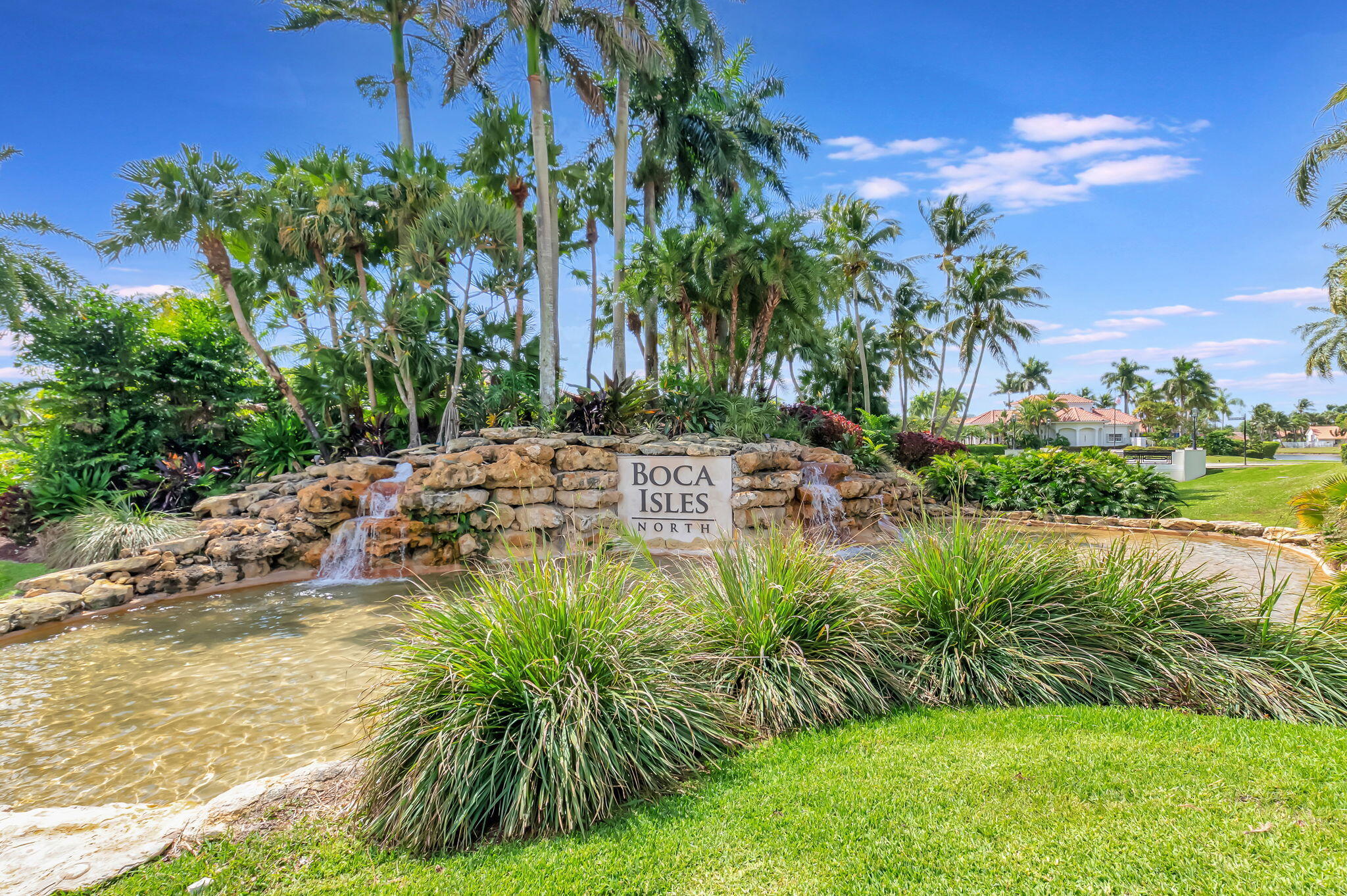 19236 Bay Leaf Court Boca Raton, FL 33498 - Photo 75 of 100 a view of a lake with a building in the background