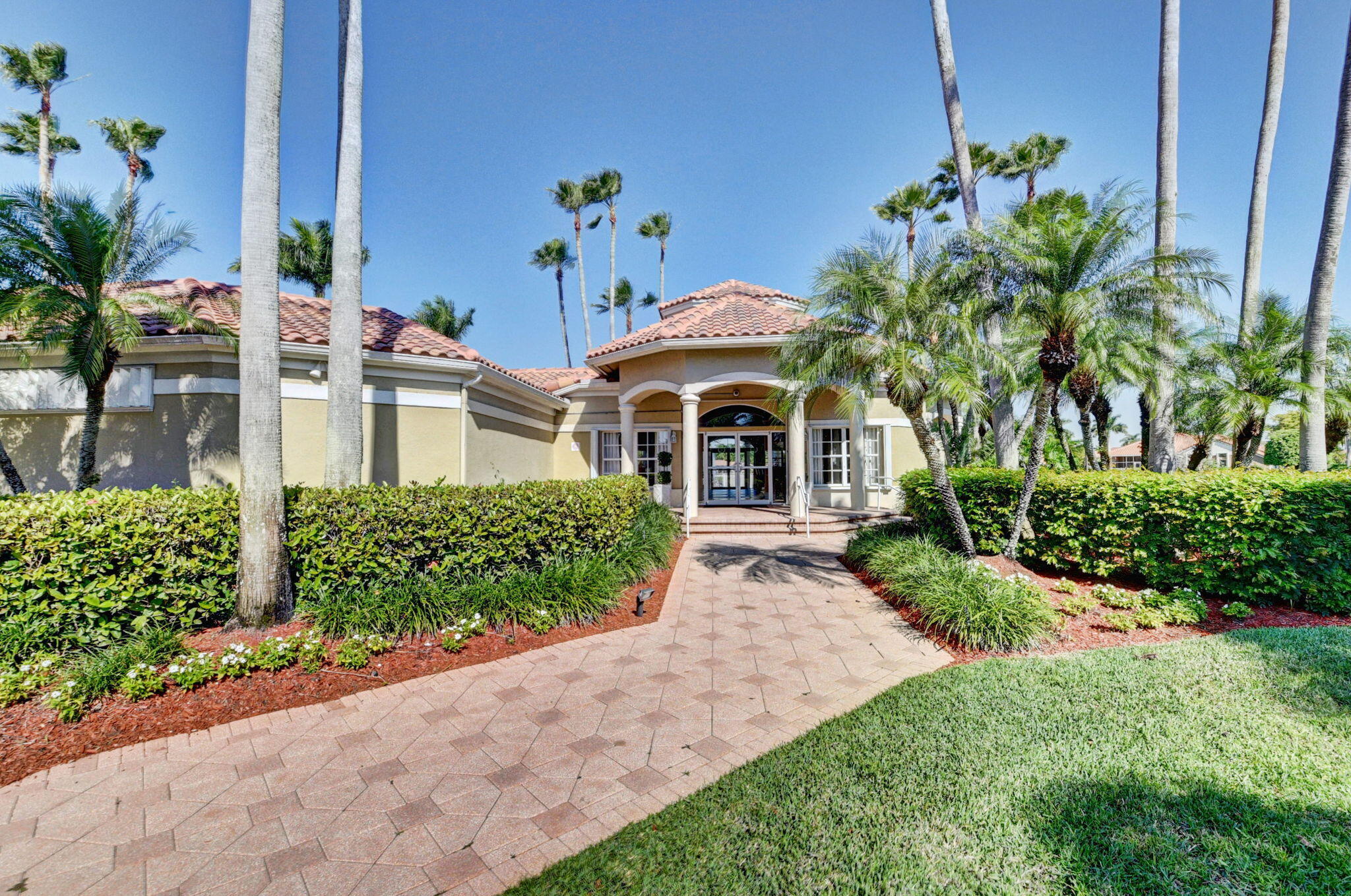 19236 Bay Leaf Court Boca Raton, FL 33498 - Photo 78 of 100 a front view of a house with a garden