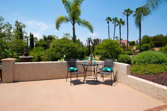 a view of table and chairs in patio