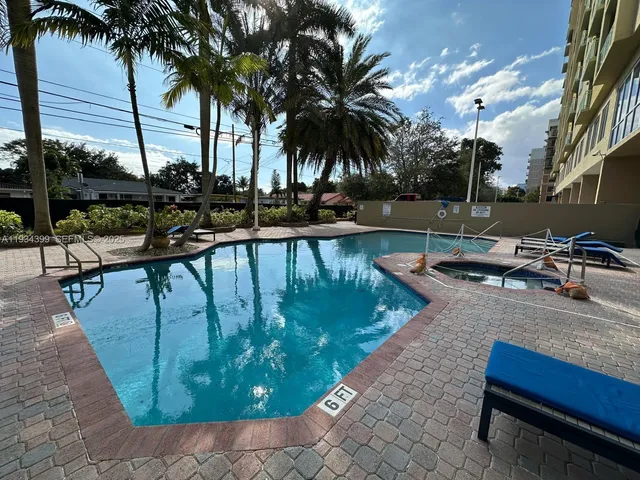 a view of a swimming pool with chairs