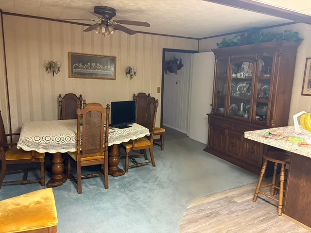 a view of a livingroom with furniture and window