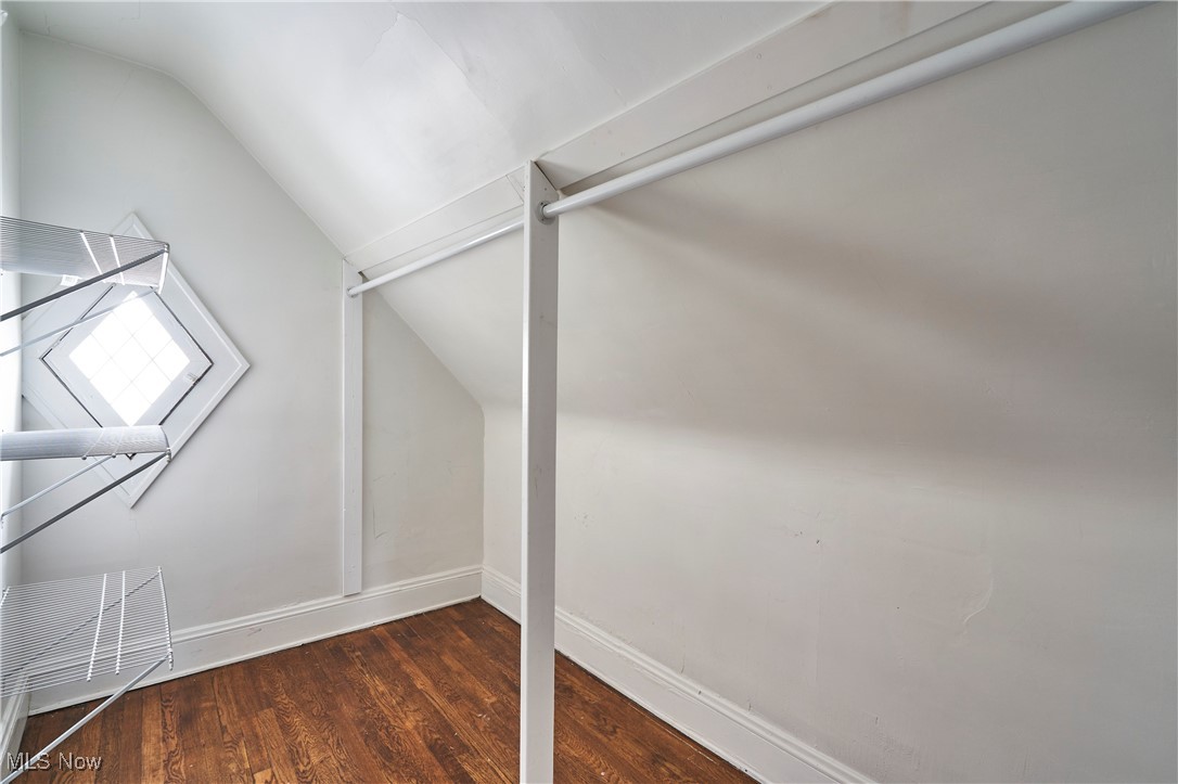 2152 Middlefield Road Cleveland, OH 44106 - Photo 15 of 50 Walk in closet with lofted ceiling and dark wood-type flooring