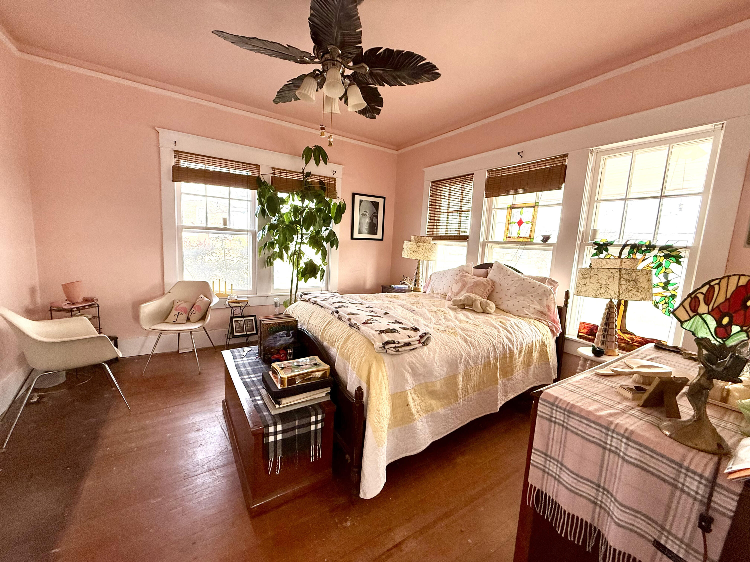 302 West 10th Street Post, TX 79356 - Photo 17 of 32 a bedroom with a bed and wooden floor