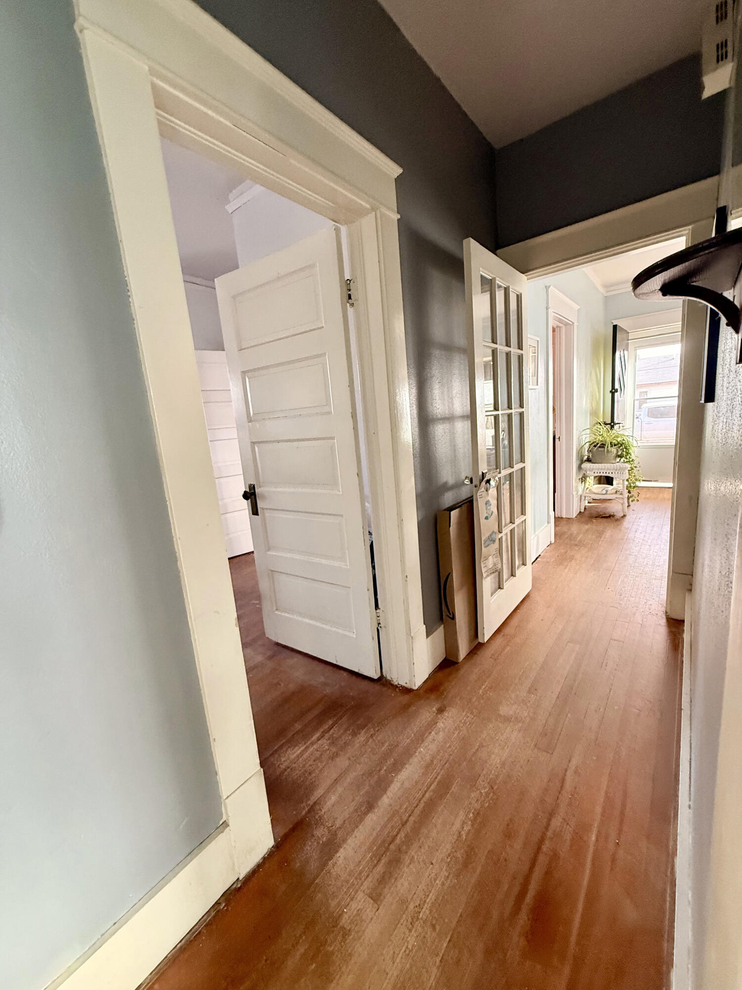 302 West 10th Street Post, TX 79356 - Photo 20 of 32 a view of a hallway with wooden floors and stairs