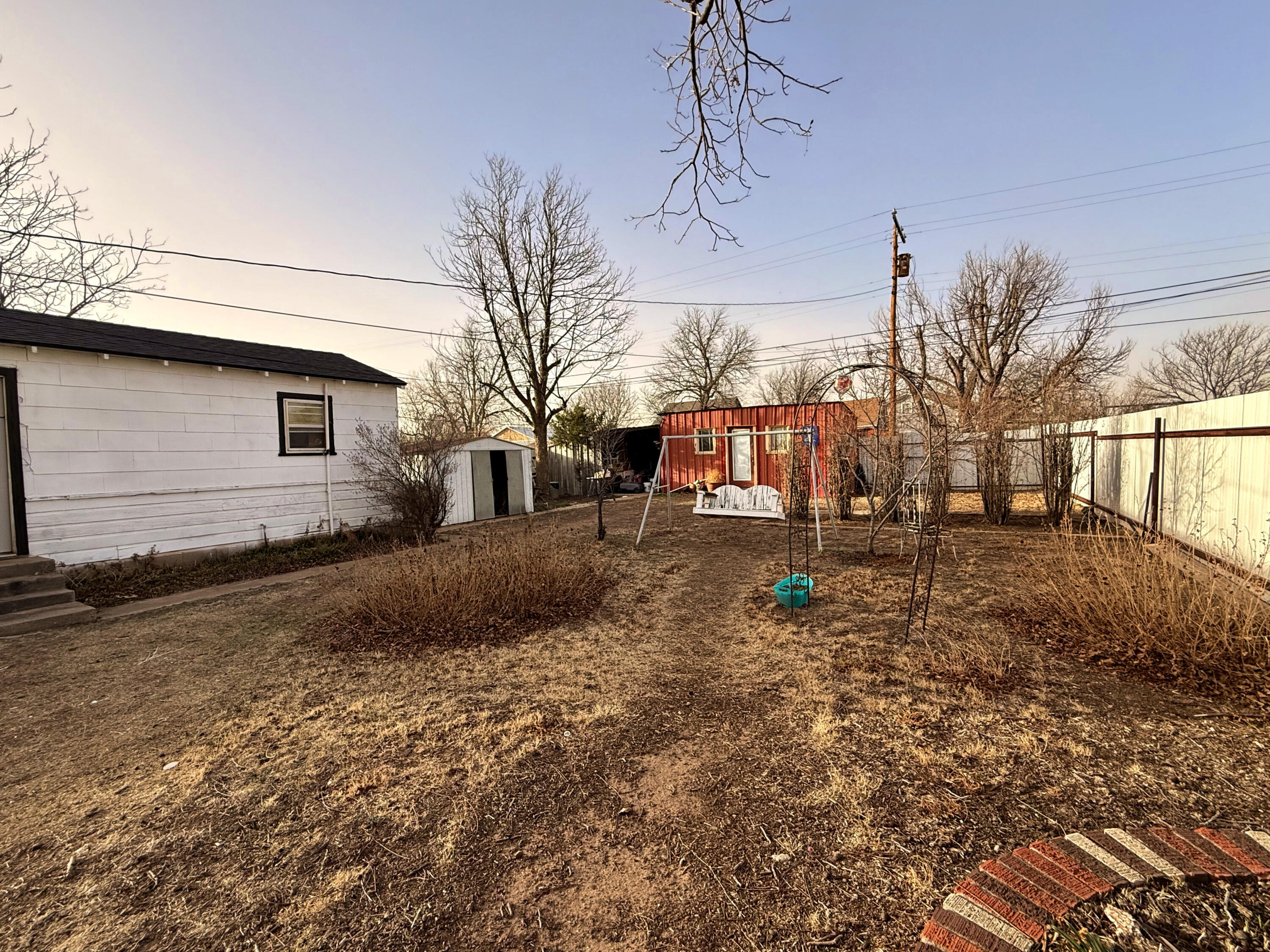 302 West 10th Street Post, TX 79356 - Photo 30 of 30 a backyard of a house with portable swimming pool and outdoor seating