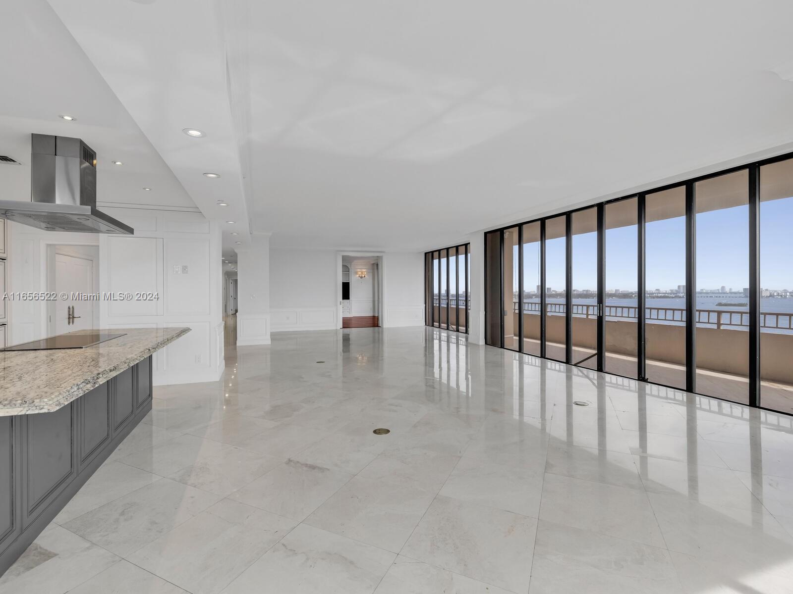 11113 Biscayne Boulevard, Unit PH5 Miami, FL 33181 - Photo 18 of 58 a view of a kitchen with a sink and cabinets