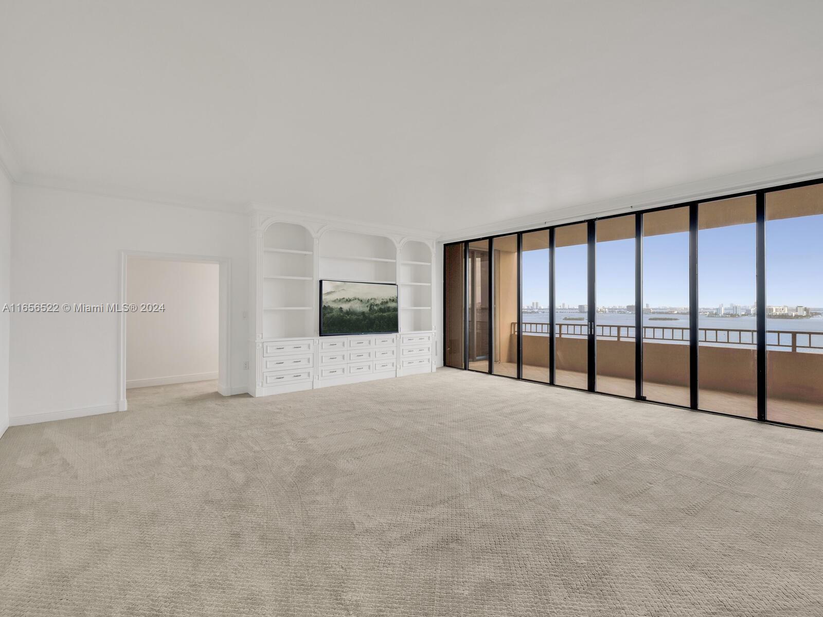 11113 Biscayne Boulevard, Unit PH5 Miami, FL 33181 - Photo 28 of 58 a view of an empty room with a window