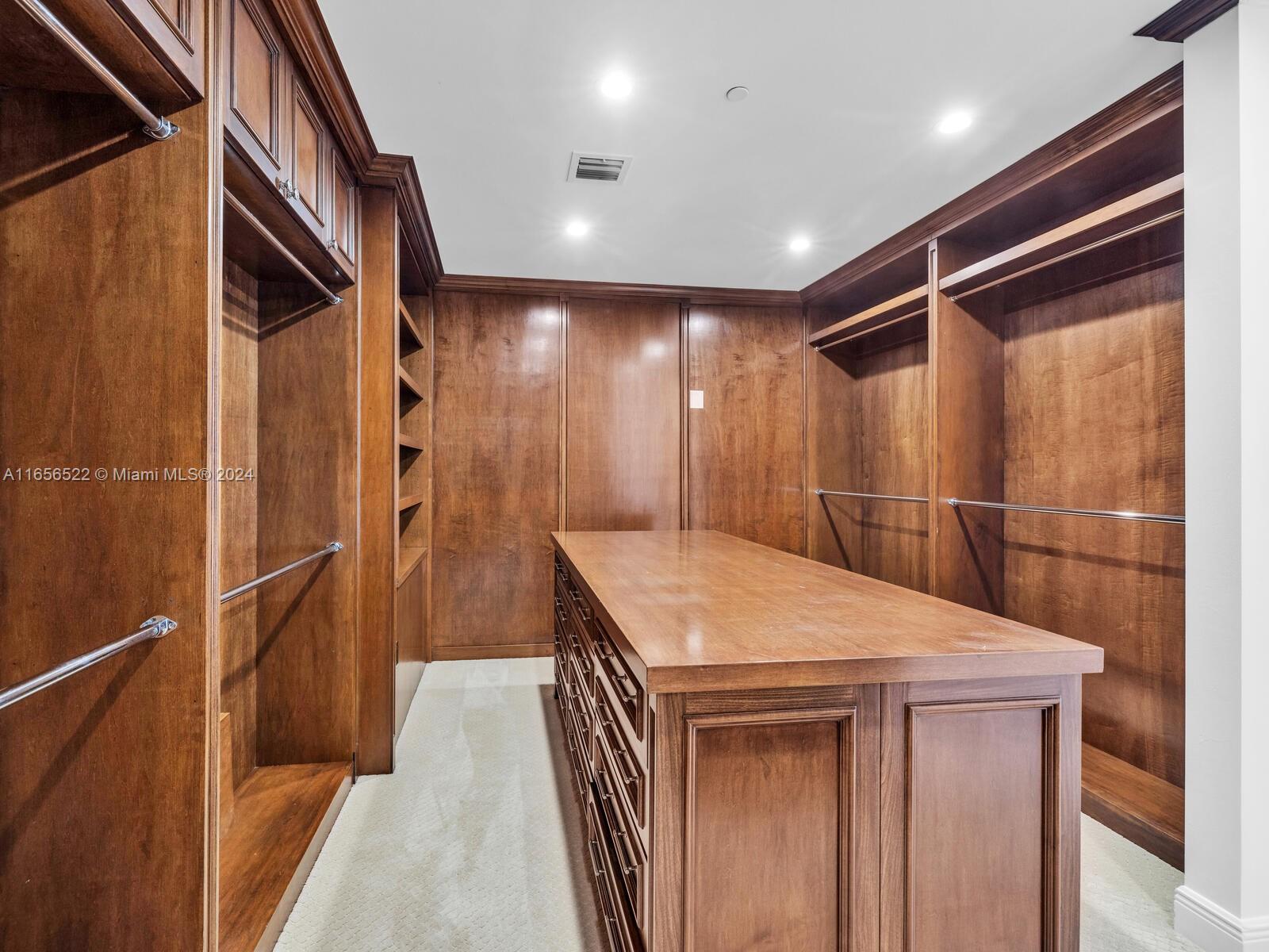 11113 Biscayne Boulevard, Unit PH5 Miami, FL 33181 - Photo 33 of 58 a bathroom with a sink and a mirror