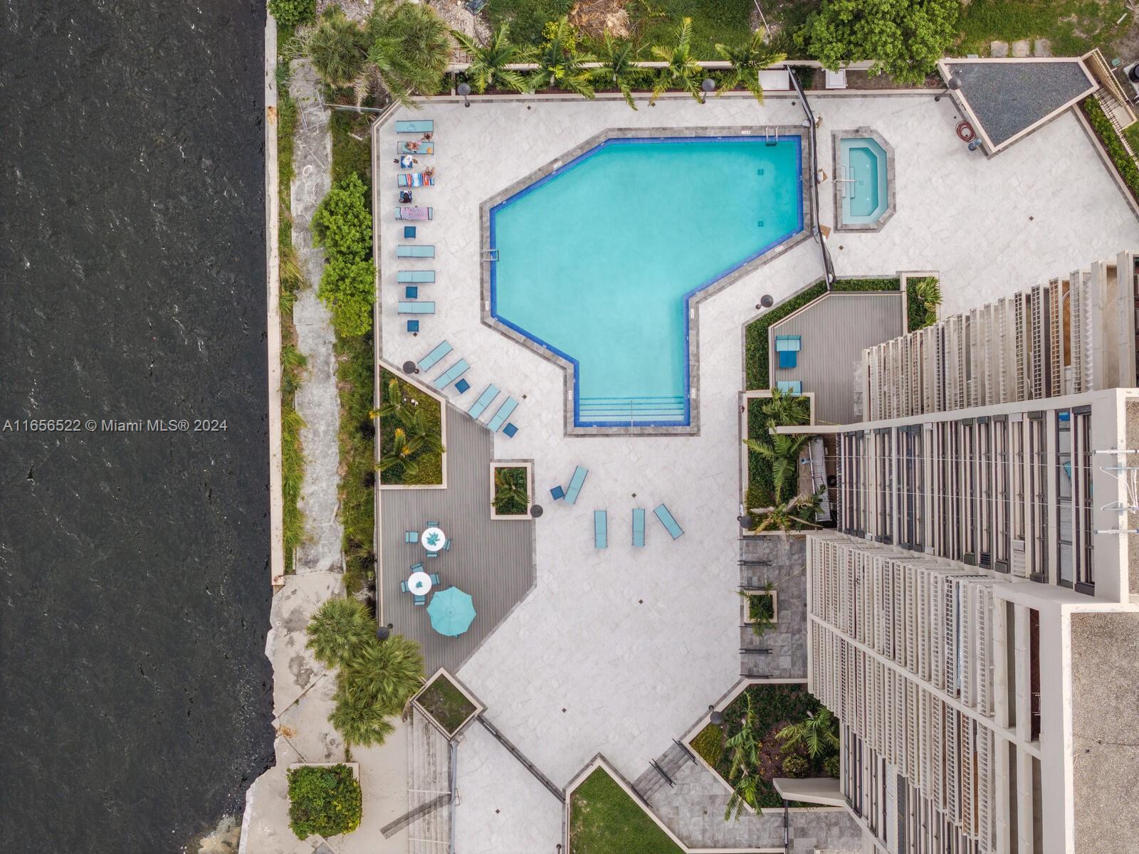 11113 Biscayne Boulevard, Unit PH5 Miami, FL 33181 - Photo 45 of 58 an aerial view of a house with a garden
