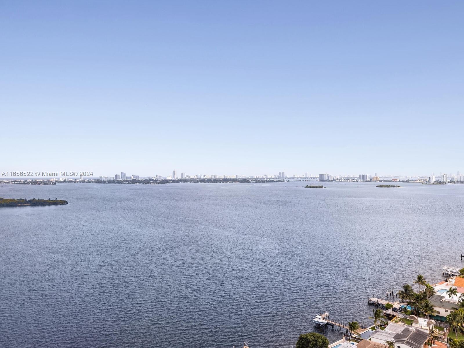 11113 Biscayne Boulevard, Unit PH5 Miami, FL 33181 - Photo 49 of 58 a view of a lake and mountain view