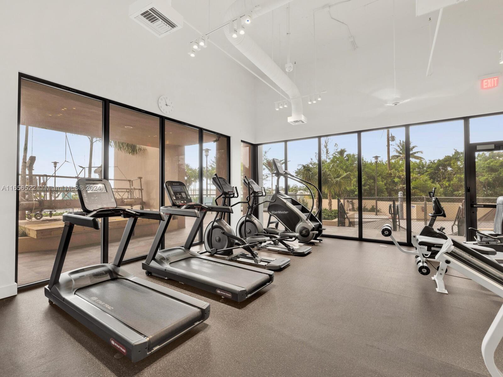 11113 Biscayne Boulevard, Unit PH5 Miami, FL 33181 - Photo 53 of 58 a view of a room with gym equipment