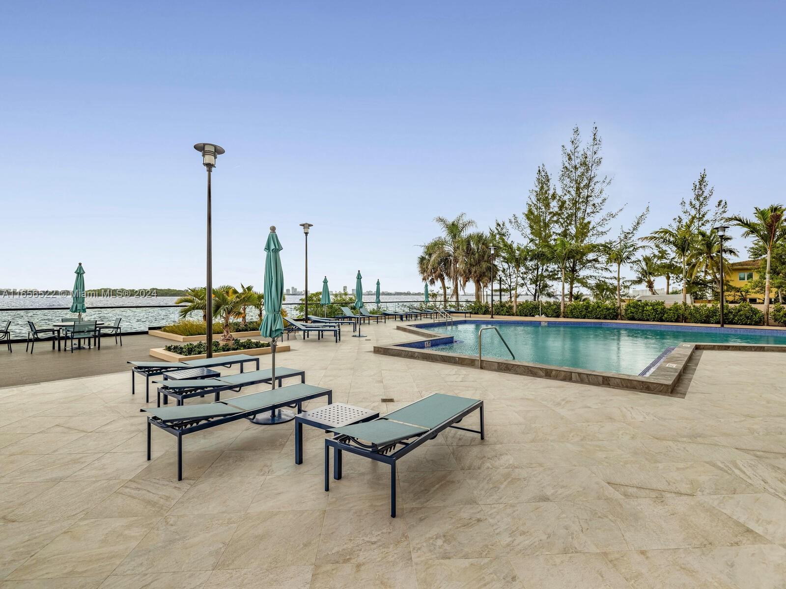 11113 Biscayne Boulevard, Unit PH5 Miami, FL 33181 - Photo 56 of 58 a view of a lake with outdoor seating