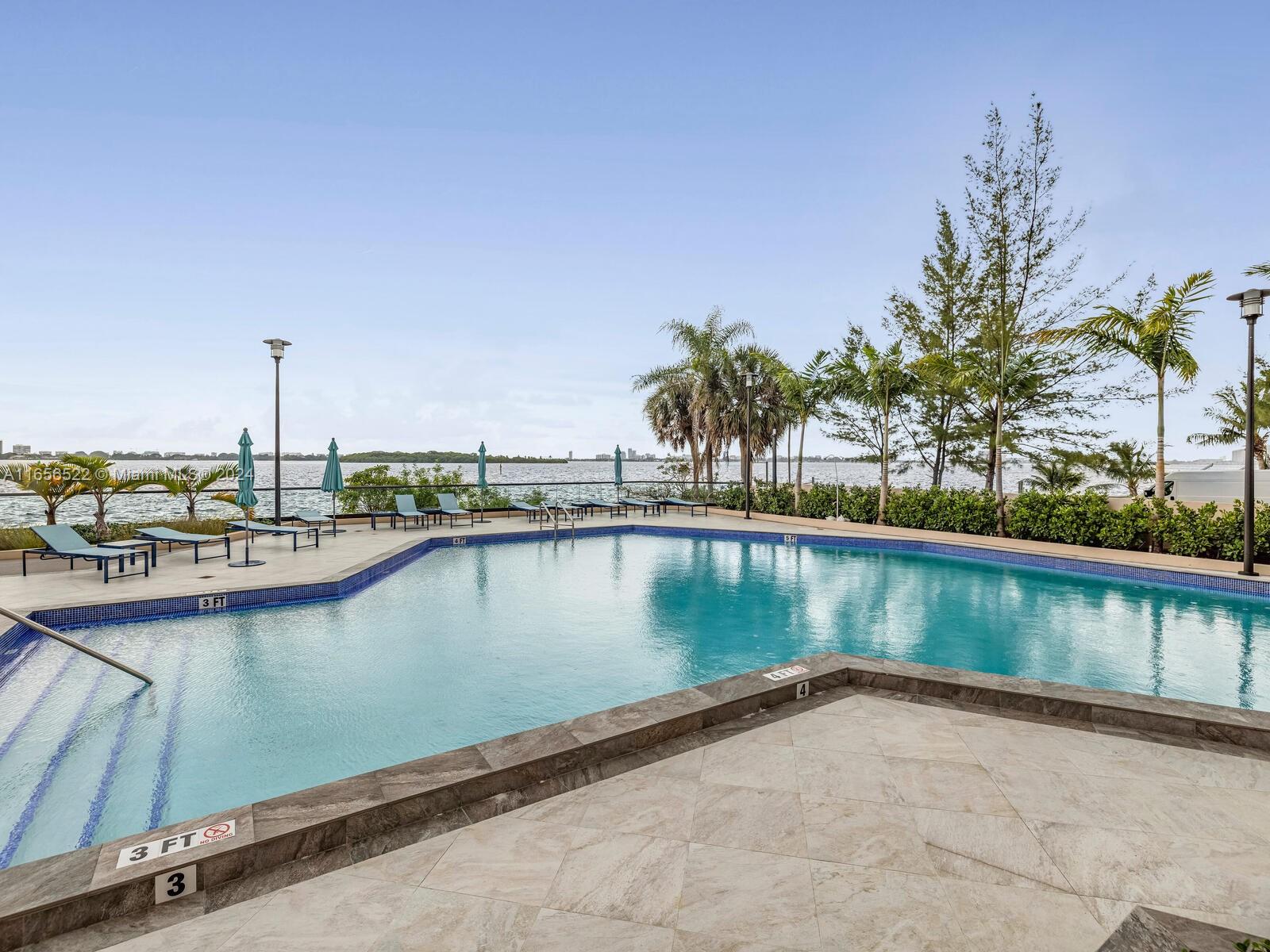 11113 Biscayne Boulevard, Unit PH5 Miami, FL 33181 - Photo 58 of 58 a view of a lake with boats in front of house