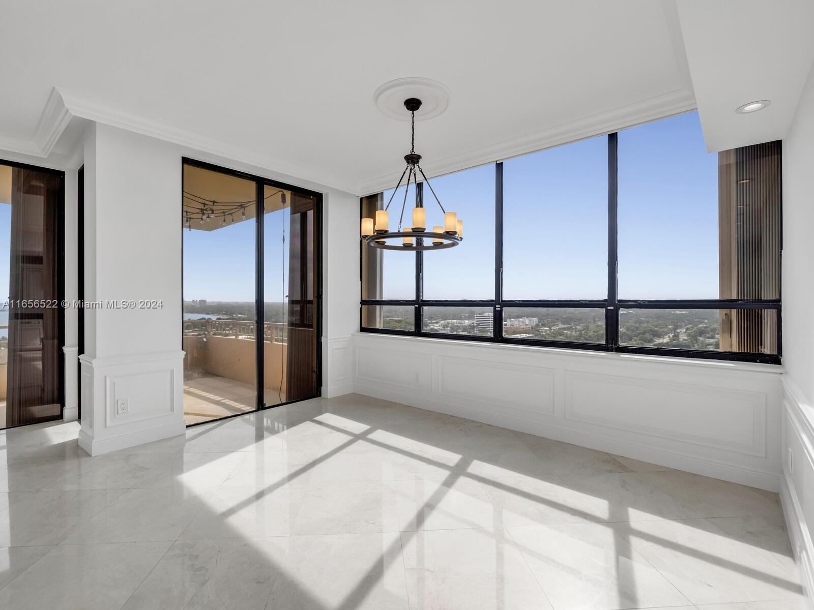 11113 Biscayne Boulevard, Unit PH5 Miami, FL 33181 - Photo 10 of 58 a view of a living room