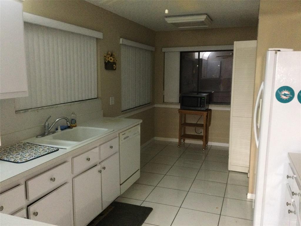 2240 Southwest 92nd Terrace, Unit 2402 Davie, FL 33324 - Photo 8 of 9 a spacious bathroom with a granite countertop sink and a mirror