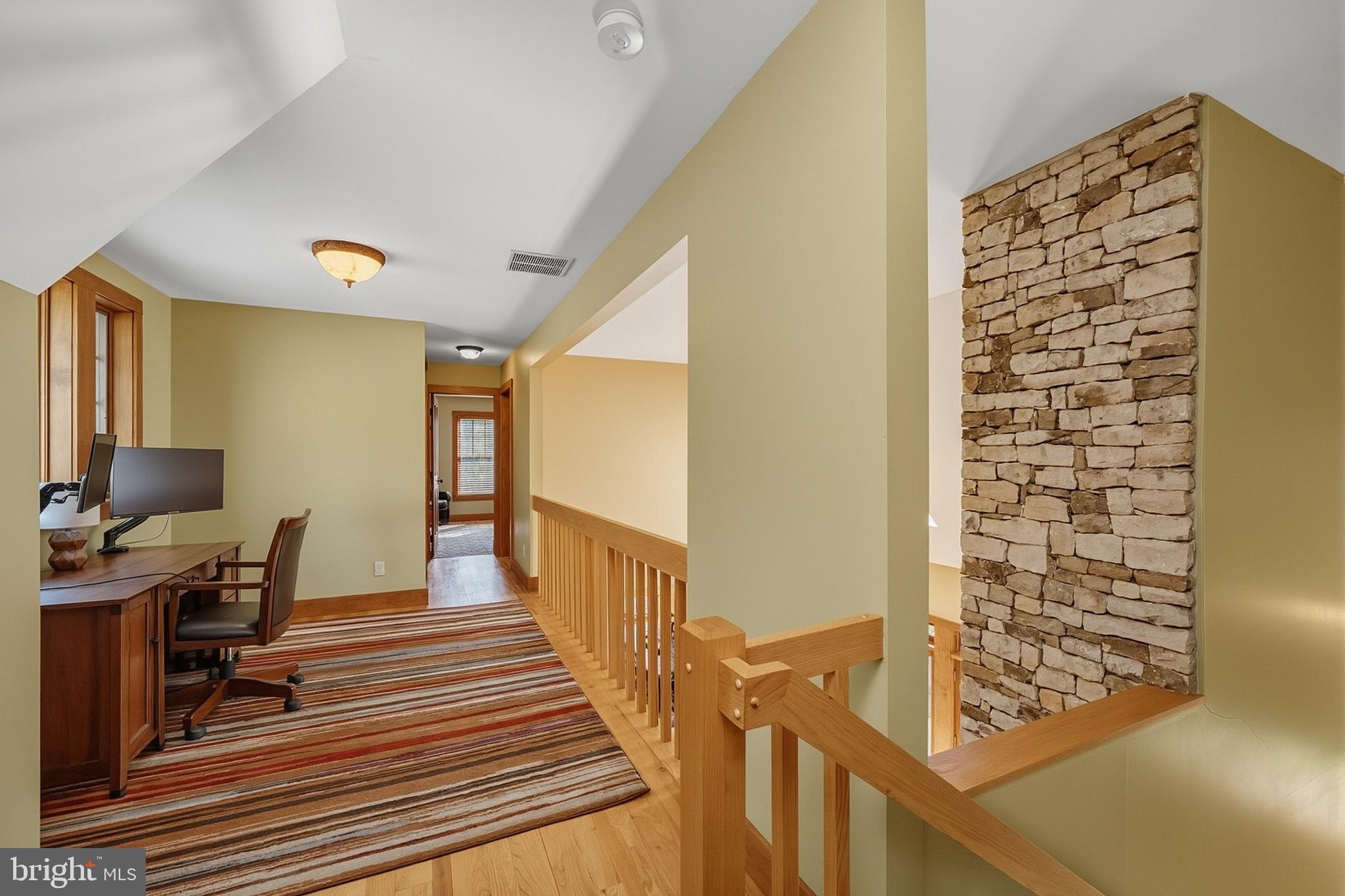 185 Ruta Lane Swanton, MD 21561 - Photo 69 of 81 a view of a hallway with workspace and wooden floor