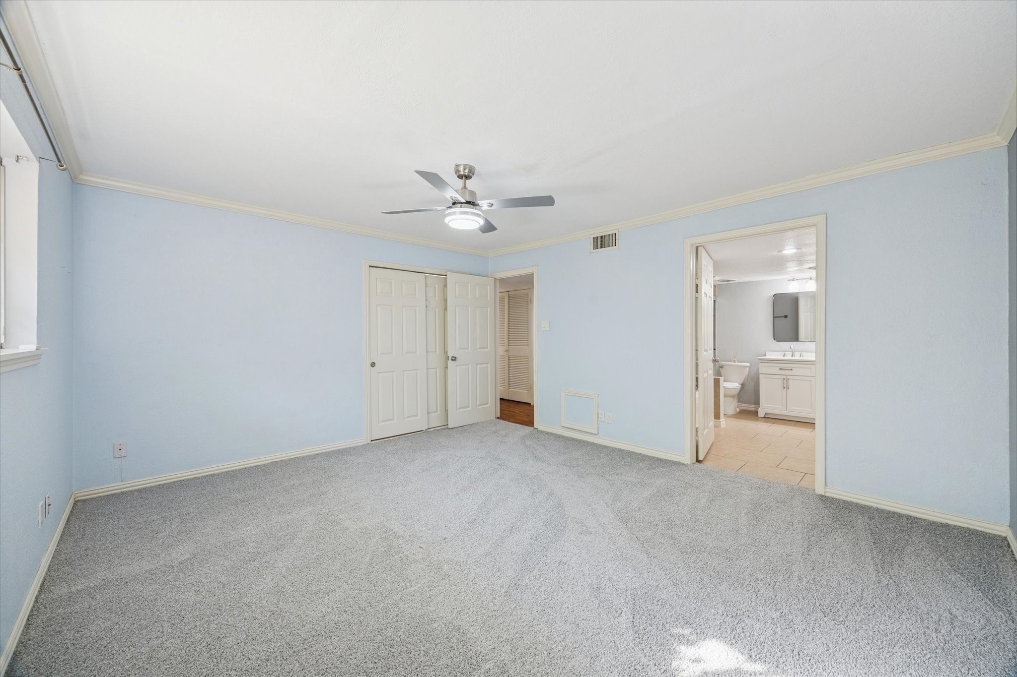 6304 Crab Orchard Road, Unit 6304 Houston, TX 77057 - Photo 14 of 23 Another view of the primary suite showcasing ample closet space and direct access to the en suite bathroom.