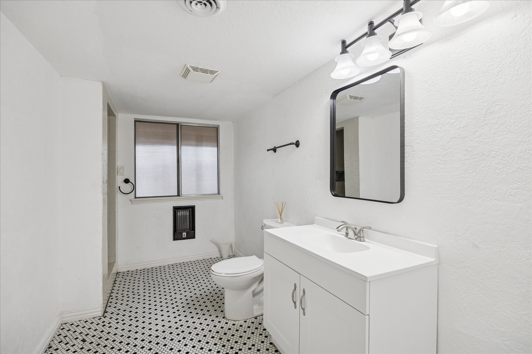 6304 Crab Orchard Road, Unit 6304 Houston, TX 77057 - Photo 19 of 23 Spacious second full bath with updated vanity, providing a clean and airy atmosphere.