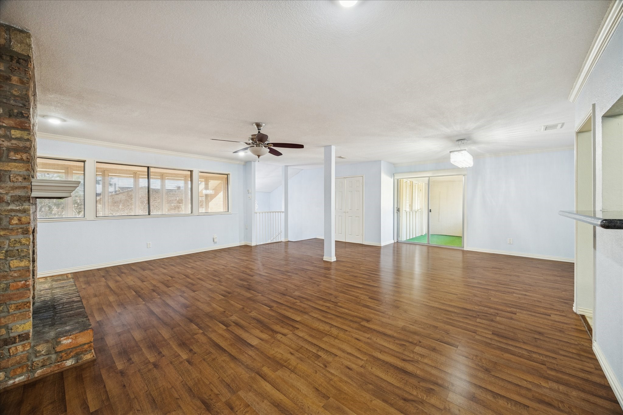 6304 Crab Orchard Road, Unit 6304 Houston, TX 77057 - Photo 10 of 23 Another perspective of the living room off the stairs, featuring a row of windows overlooking the front, dedicated dining space and added closet storage.