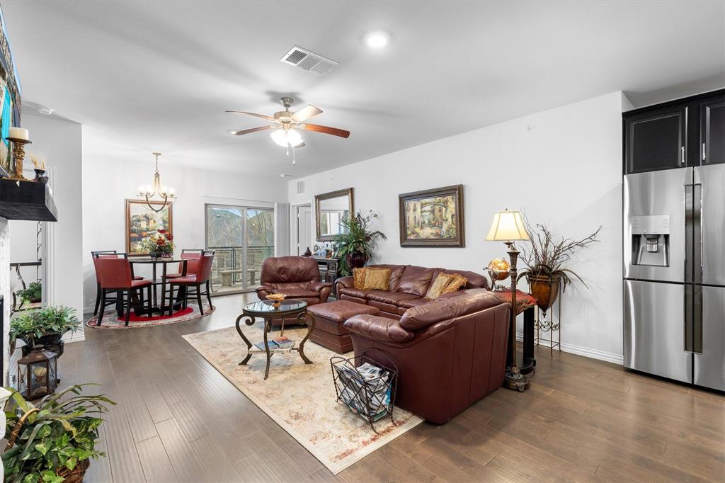 651 Watters Road, Unit 5205 Allen, TX 75013 - Photo 7 of 31 a living room with furniture a flat screen tv and a window