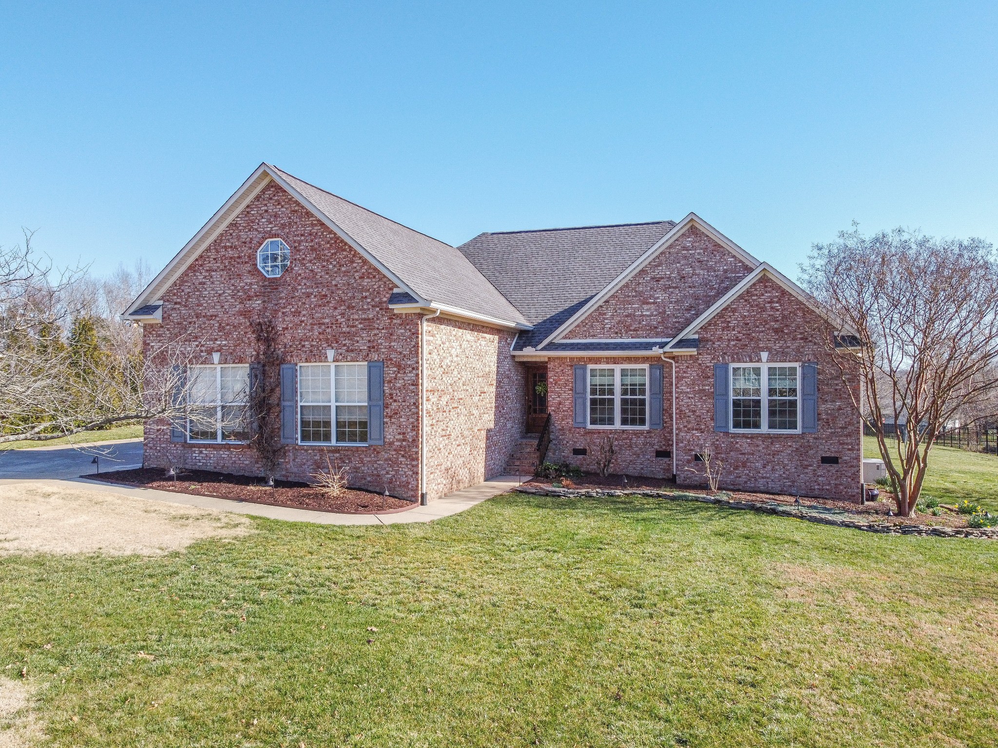 1982 Lasea Road Spring Hill, TN 37174 - Photo 5 of 64 a front view of a house with a yard