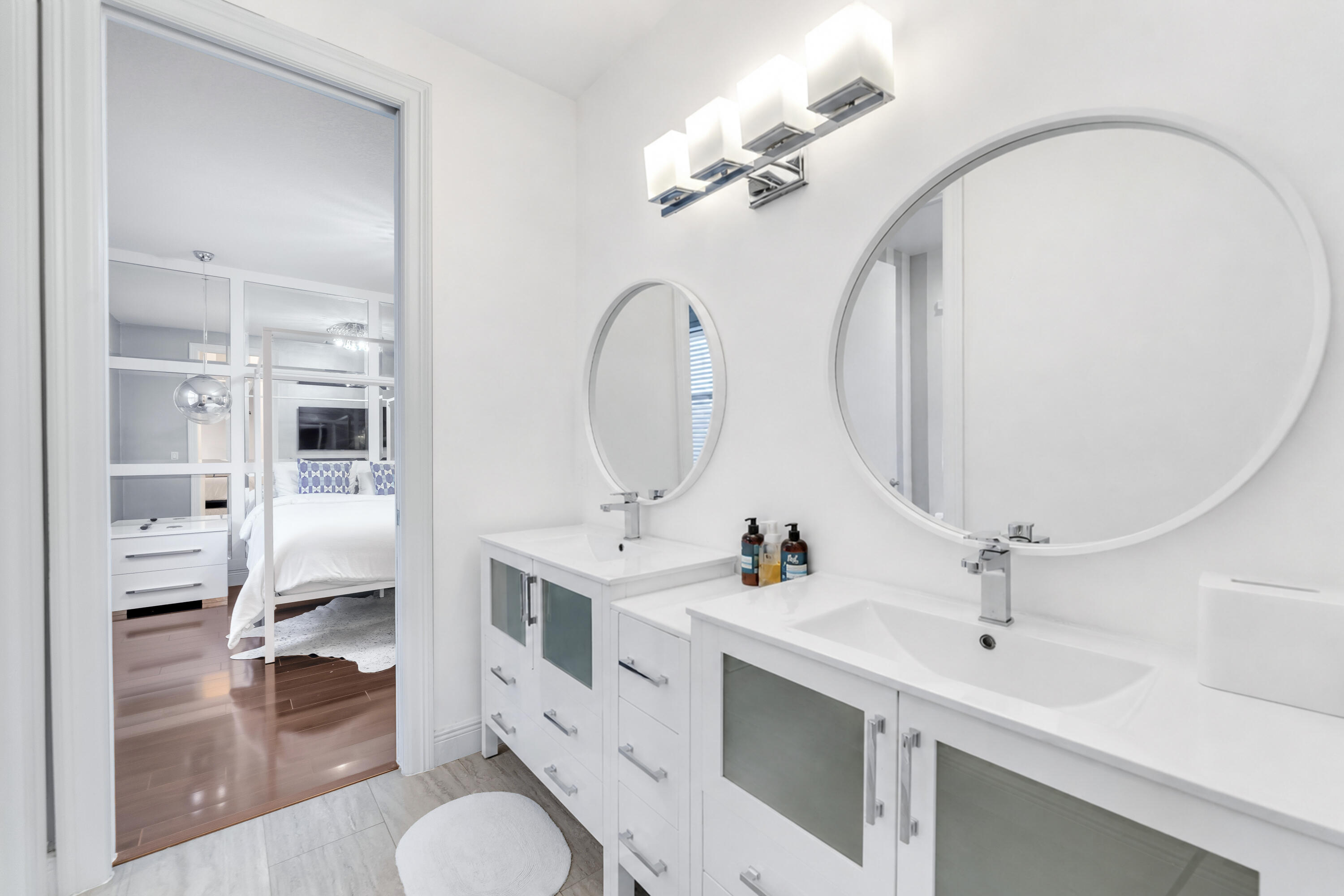 3156 Northwest 61st Street Boca Raton, FL 33496 - Photo 30 of 46 a bathroom with a sink and a mirror