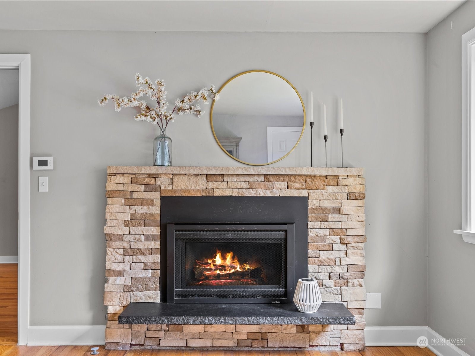 112 Poppy Road Bothell, WA 98012 - Photo 8 of 33 a living room with a fireplace and a fireplace