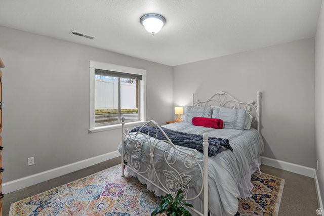 1896 West 800 North Mapleton, UT 84663 - Photo 32 of 55 Bedroom featuring baseboards and a textured ceiling