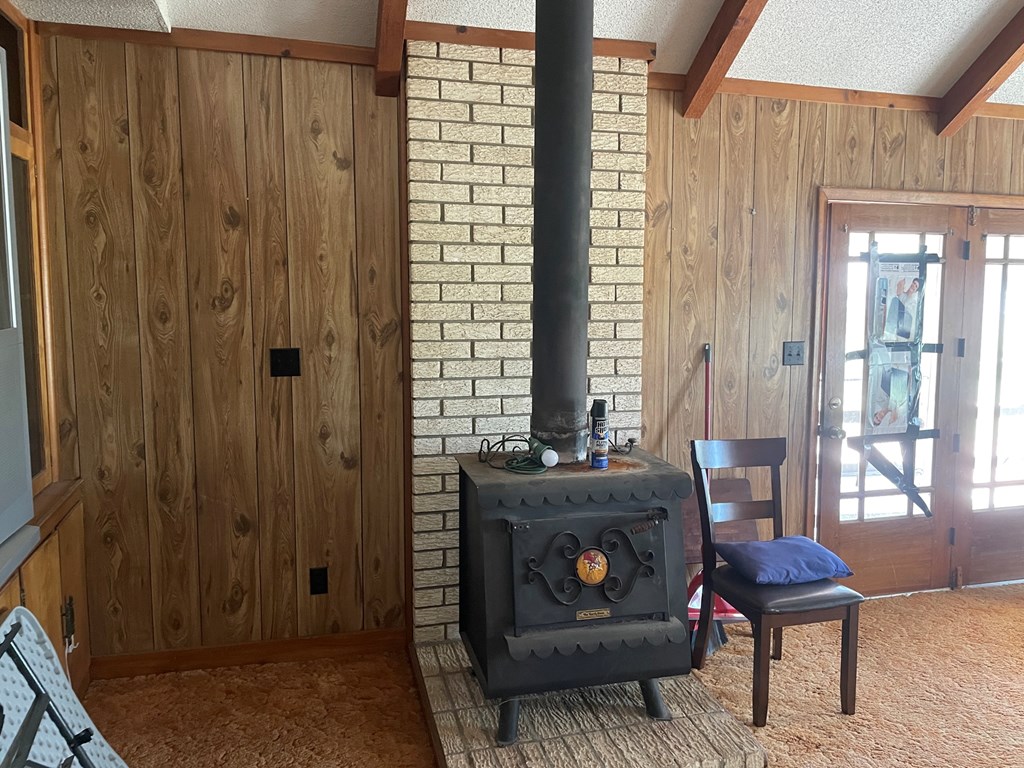2204 Lange Polk Road Brady, TX 76825 - Photo 22 of 30 a living room with furniture and a fireplace