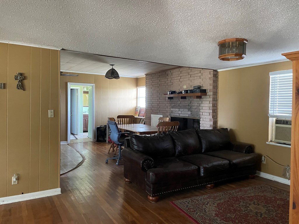 2204 Lange Polk Road Brady, TX 76825 - Photo 26 of 30 a living room with furniture and a fireplace