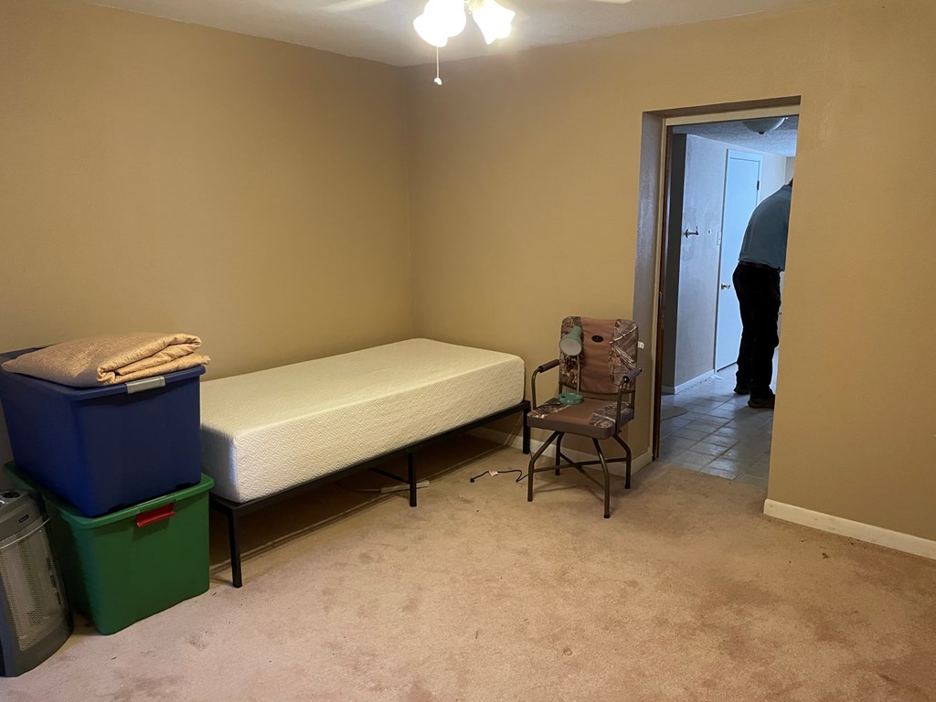 2204 Lange Polk Road Brady, TX 76825 - Photo 28 of 30 a bedroom with a bed and a closet