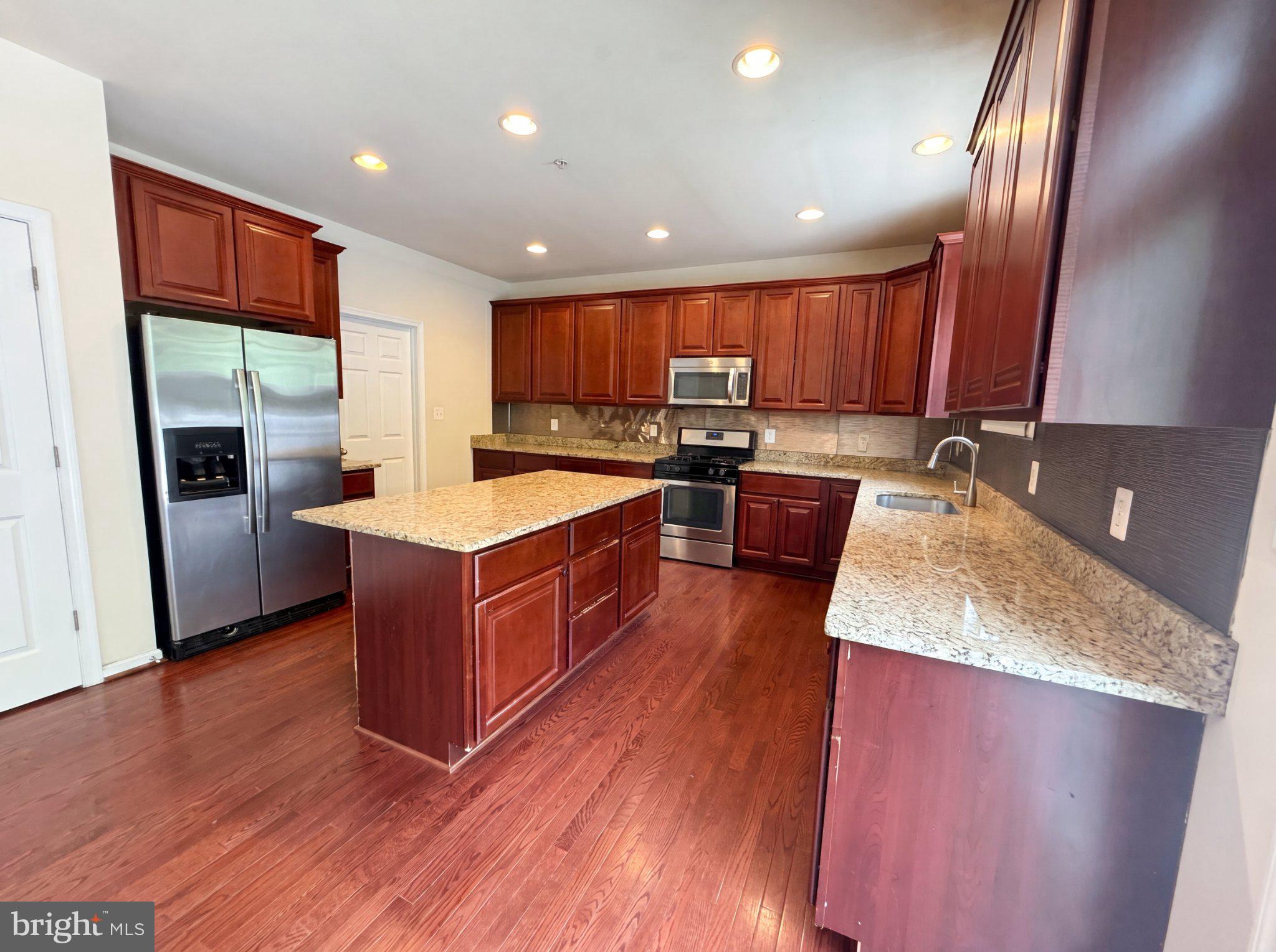 7923 Fawn Run Jessup, MD 20794 - Photo 2 of 22 Spacious kitchen with rich cabinetry.
