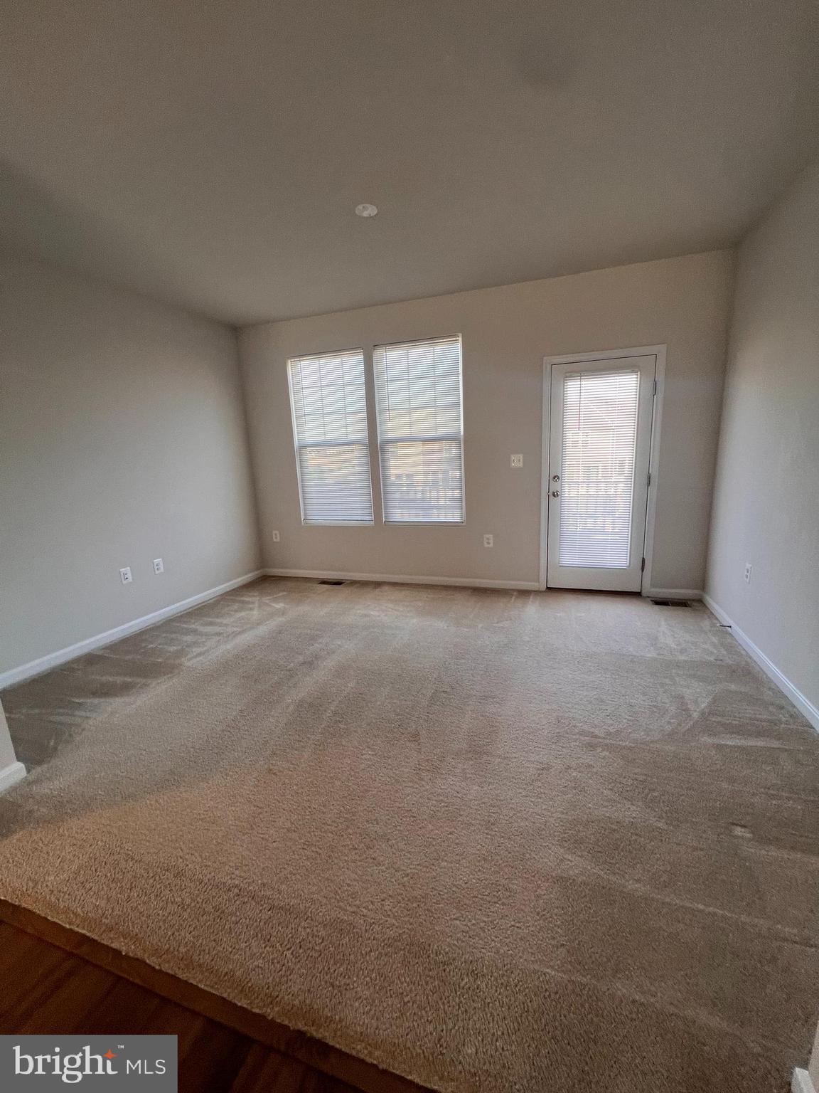 36 Anthem Street Ranson, WV 25438 - Photo 7 of 16 an empty room with windows